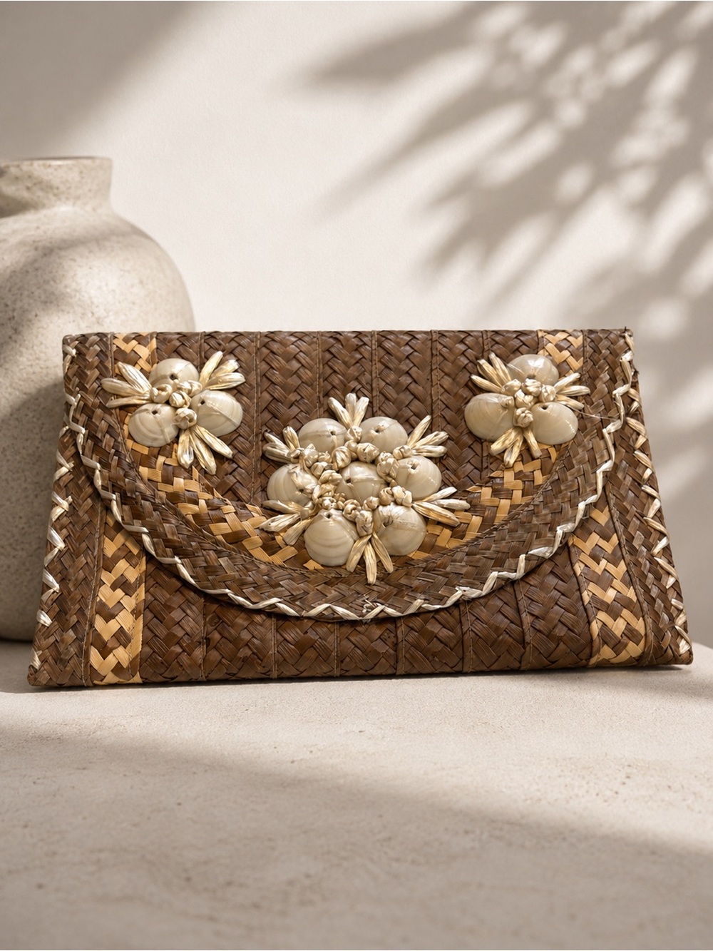 Artisan Woven Brown Straw Clutch with Cream Shell Floral Embellishments